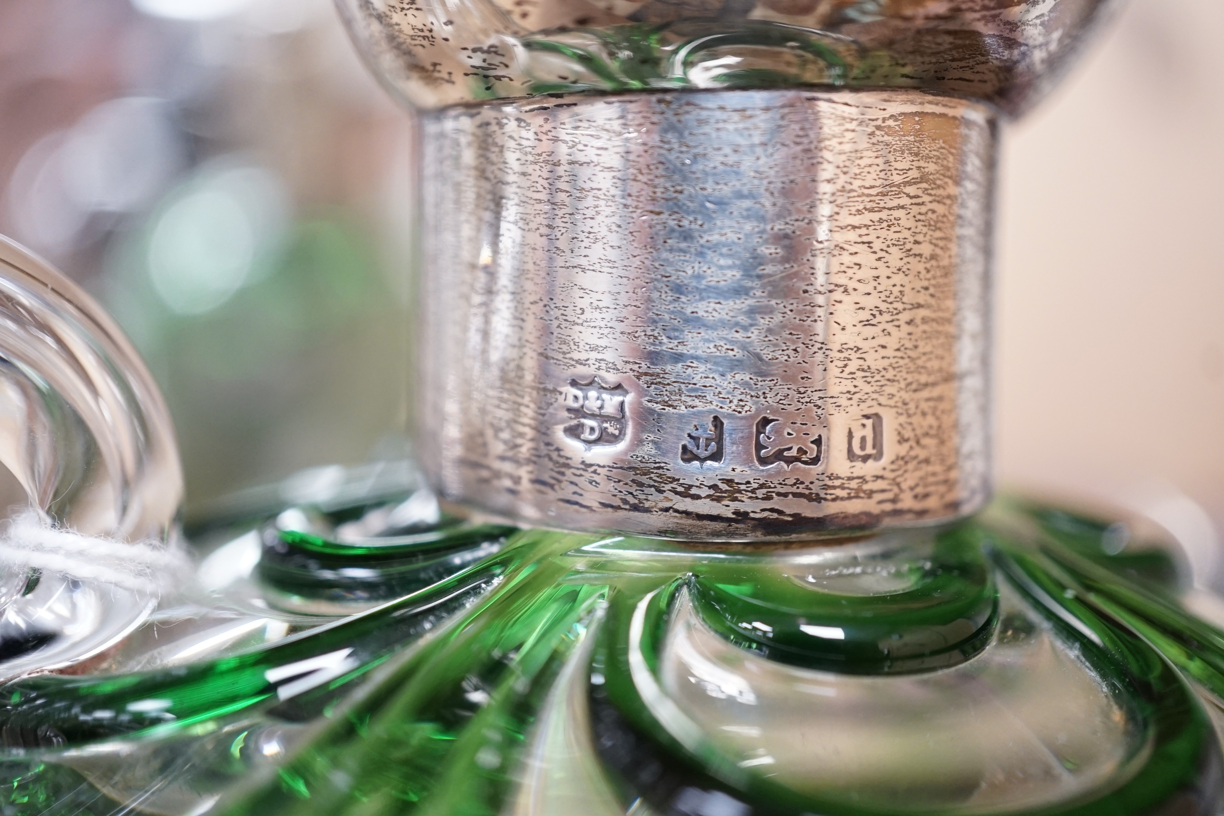 A late Victorian Art Nouveau silver mounted glass claret jug and stopper, D & M Davis, Birmingham, 1900, the glass with ribbed green swags, height 20.7cm.